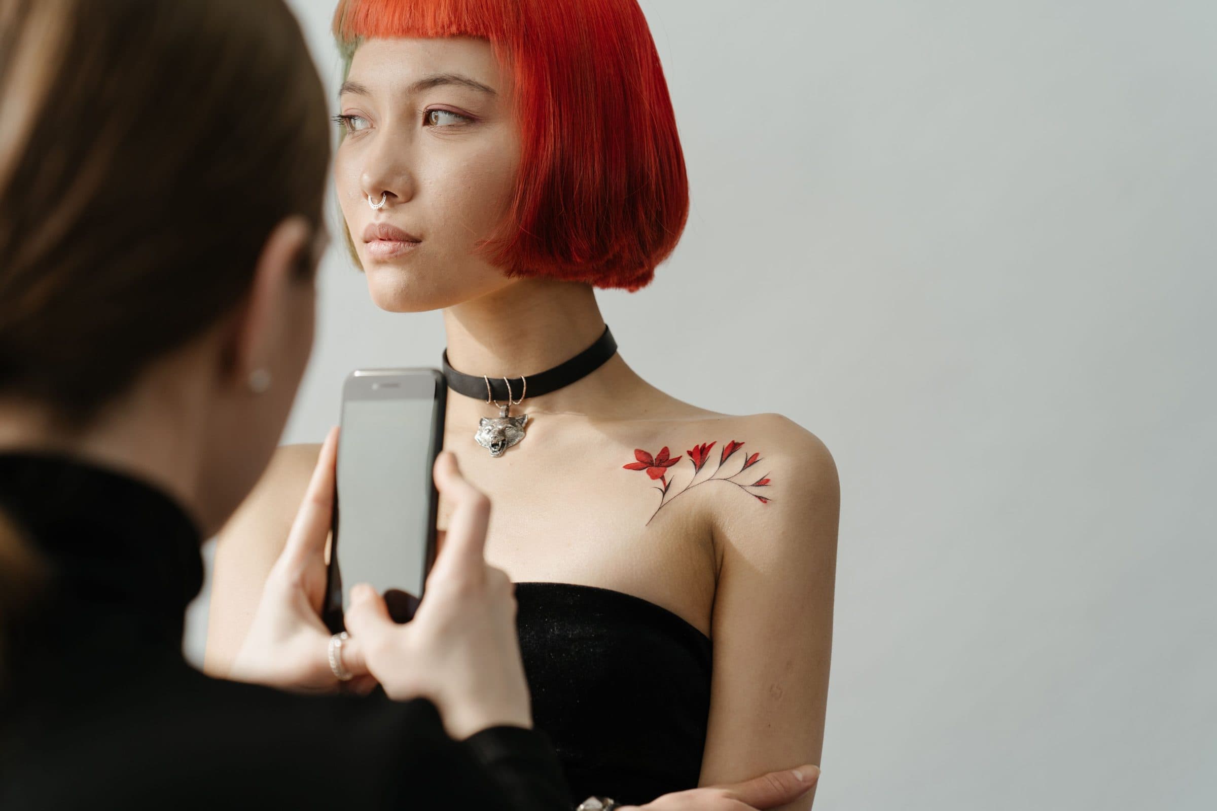 Client being photographed with a phone