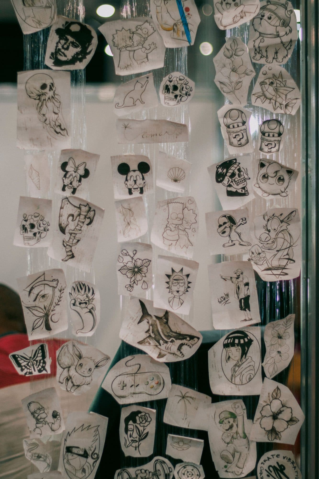 Wall full of flash designs on paper